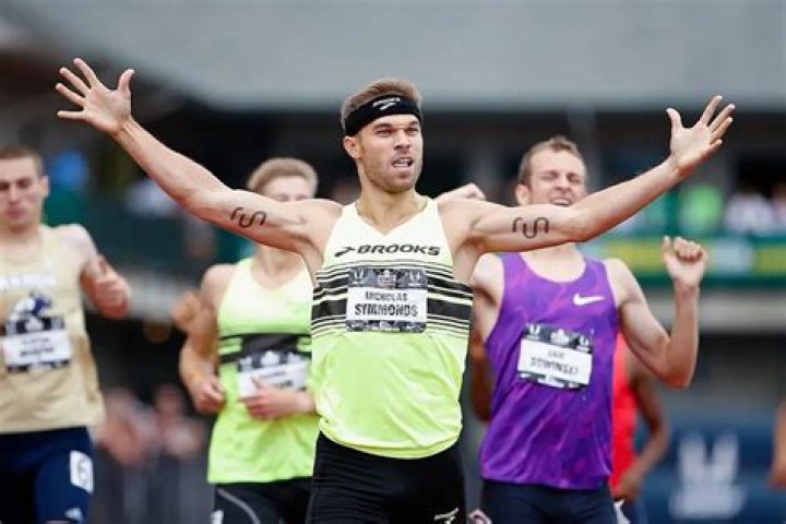 T-Mobile CEO John Legere Buys Ad Space On Shoulder Of Olympian Runner Nick Symmonds